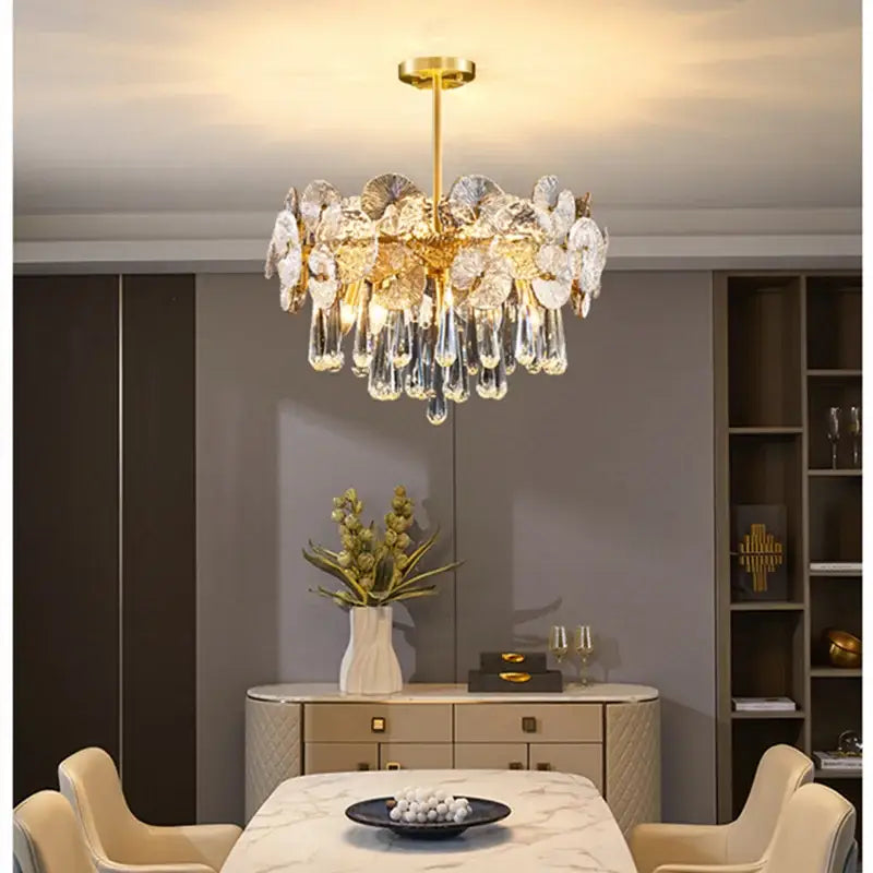 Exquisite golden fan crystal chandelier with gold-toned frame and clear crystal flower and teardrop accents for living room