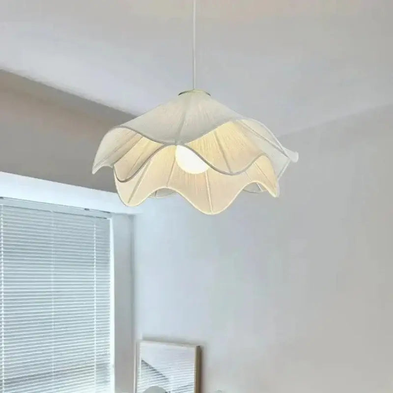 Fabric petal pendant light by decorbites features delicate off-white fabric with soft ruffled petals for dining room decor