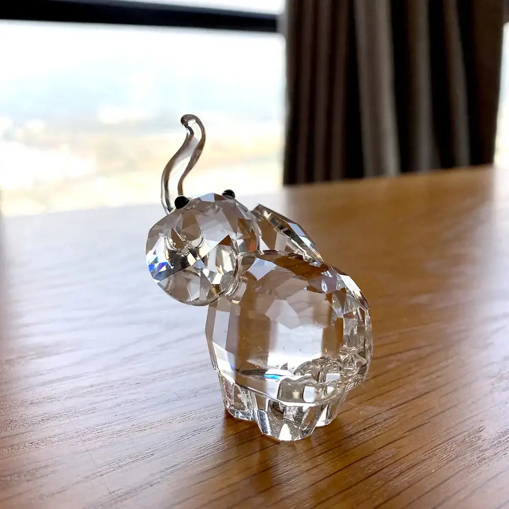 Faceted clear glass elephant figurine with a curved trunk and black bead eyes for living room decorbites decor