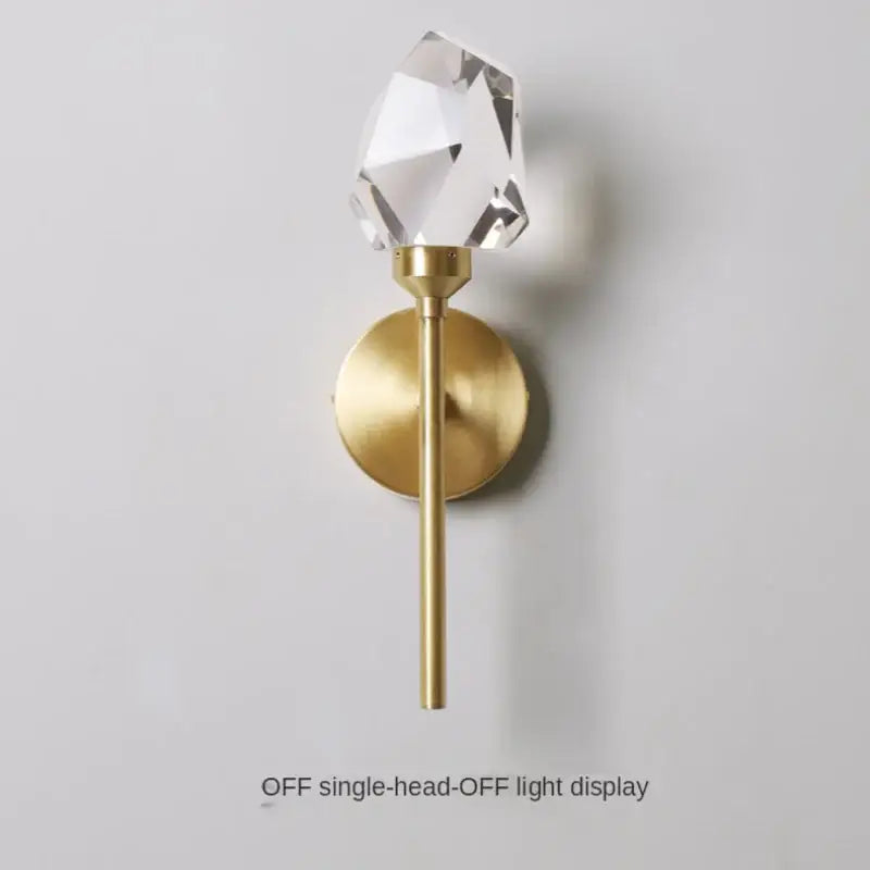 Faceted crystal gold led wall sconce with clear crystal and brushed gold metal base for bedroom and living room decorbites