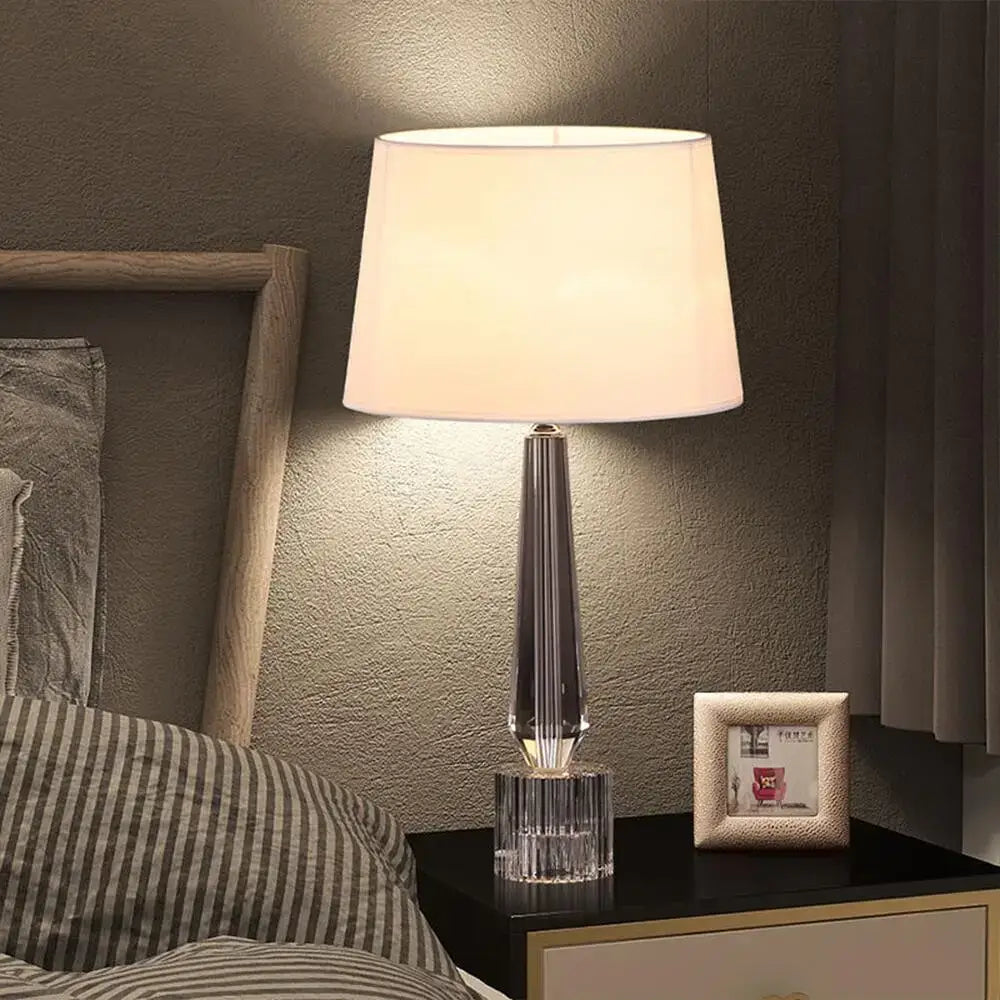Elegant decorbites crystal table lamp with faceted base and off-white fabric shade for bedroom light fixture
