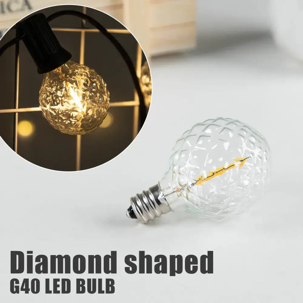 Clear diamond-shaped g40 string lights bulb with textured glass and exposed filament for outdoor garden use