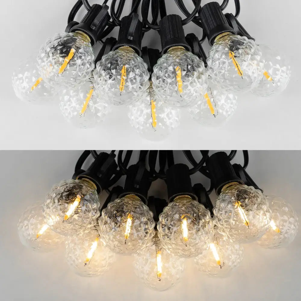 Clear faceted glass g40 string lights with textured globe bulbs and black bases featuring visible led filaments for outdoor use