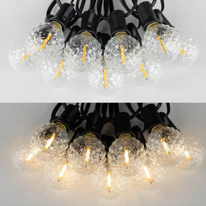 Clear faceted glass g40 string lights with textured globe bulbs and black bases featuring visible led filaments for outdoor use