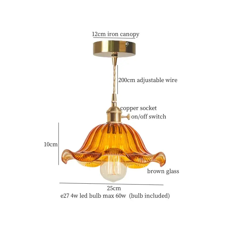 A warm amber glass pleats led pendant light with brass hardware for dining room use featuring faceted design