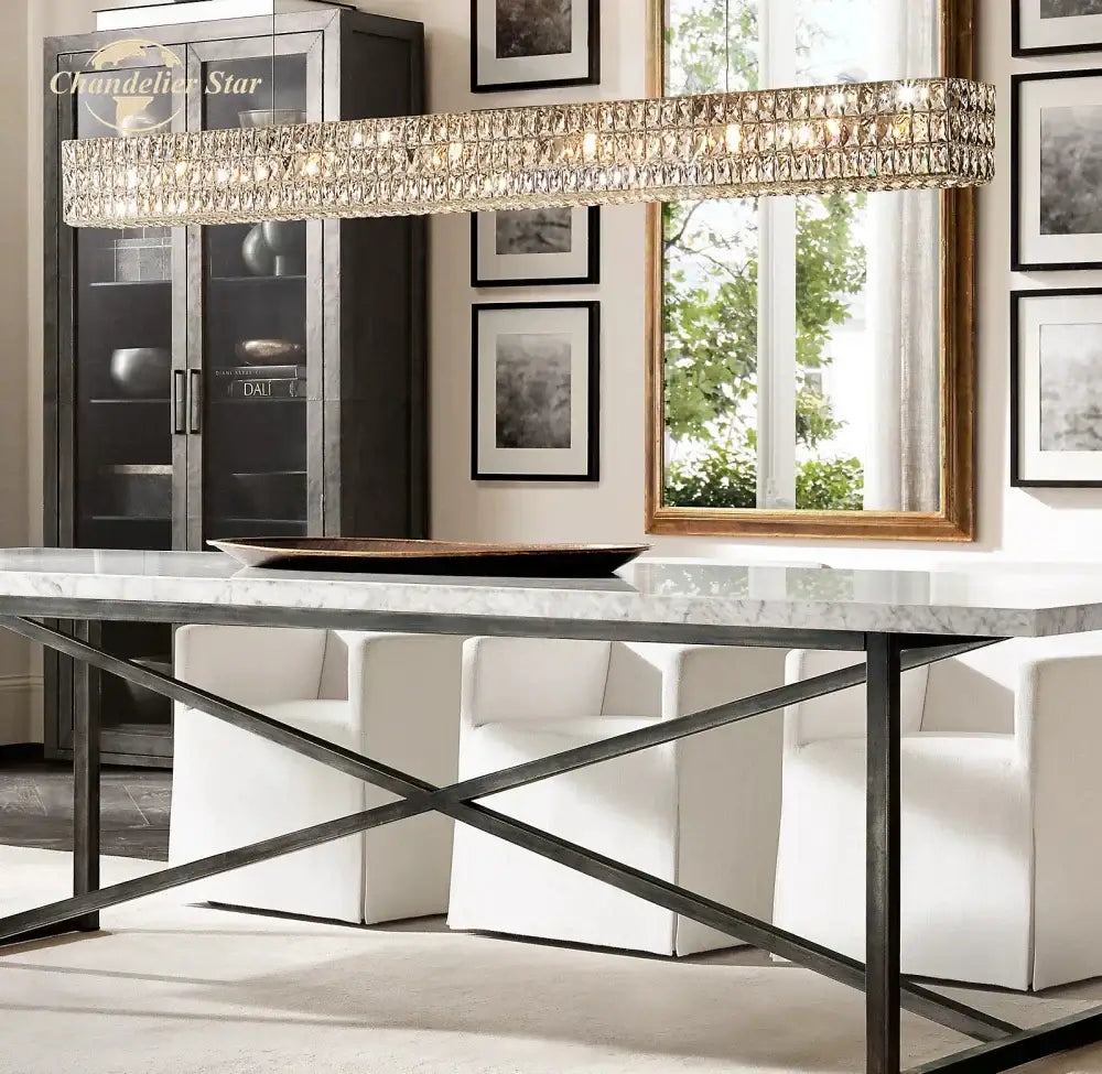 Faceted gold crystal led linear chandelier with metallic frame hanging above dining table for decorbites crystal led decor