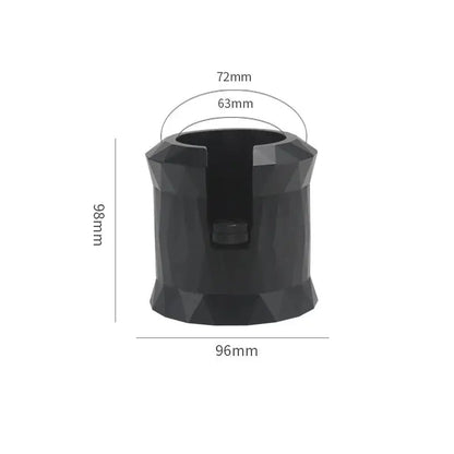 Faceted matte black metal espresso portafilter holder with central slot and dimensions 98mm tall by 96mm wide base
