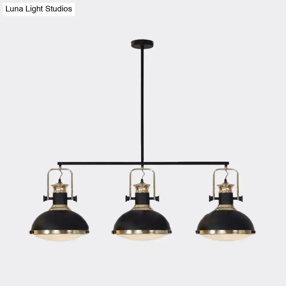 DecorBites™ farmhouse three-light island pendant with black metal dome shades and brass accents for dining room down lighting