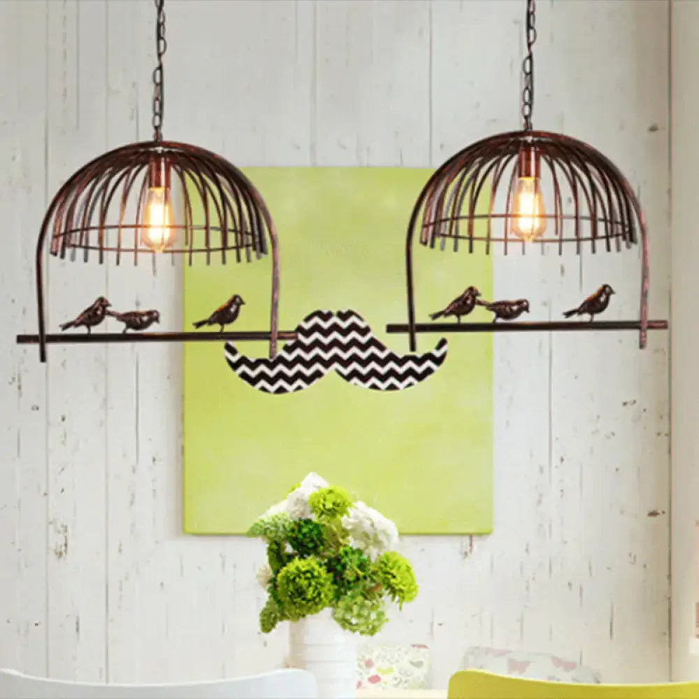 Rustic farmhouse black metal birdcage light fixture with exposed filament bulbs for dining room ceiling illumination