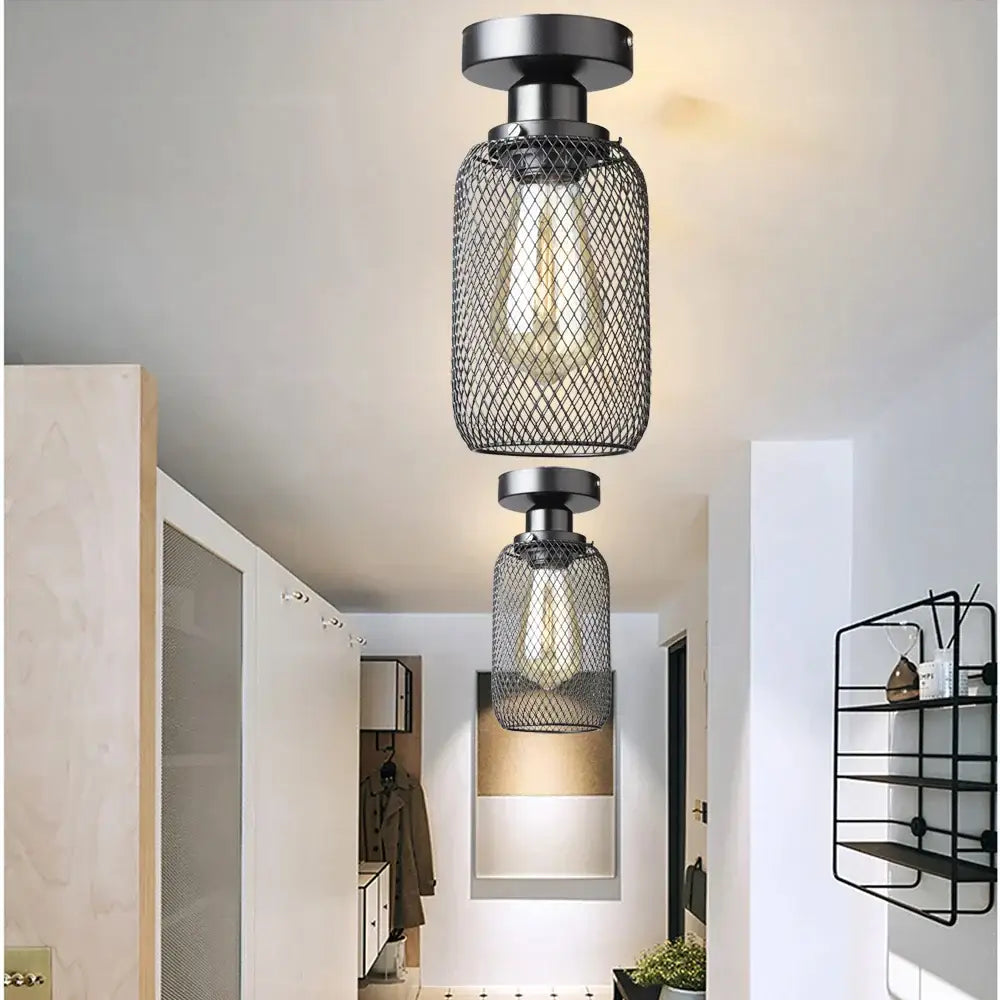 Farmhouse black metal cage ceiling light with industrial mesh design and exposed edison bulb by decorbites black metal