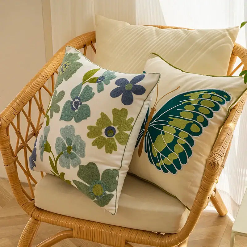 Cream-colored pillow cover with embroidered green blue floral and butterfly designs for decorbites decorative farmhouse throw