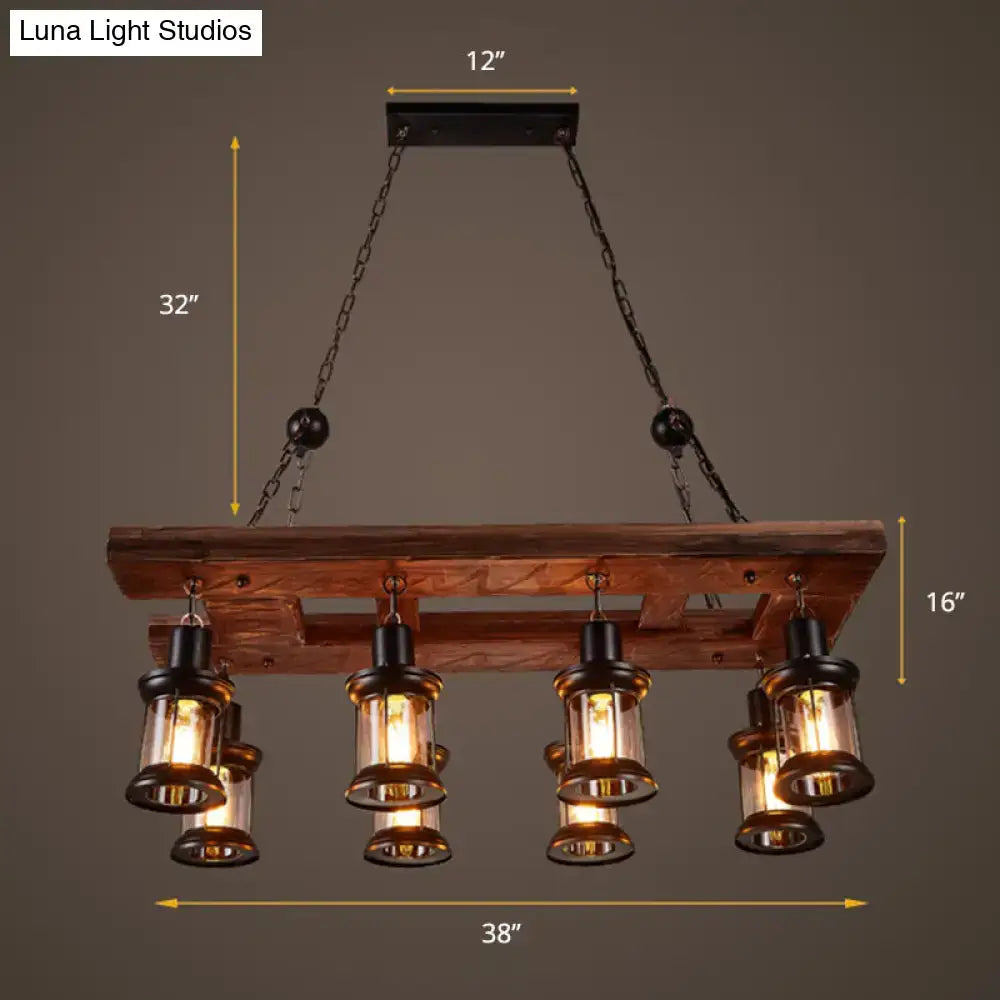 Rustic farmhouse wood and black metal kitchen island light with five clear glass lanterns and black accents