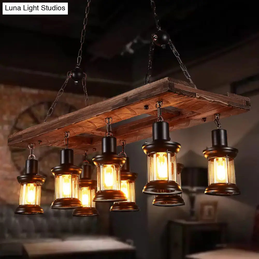 DecorBites™ farmhouse clear glass lantern chandelier with 8 wood lights and brass-finished lamps on rustic plank