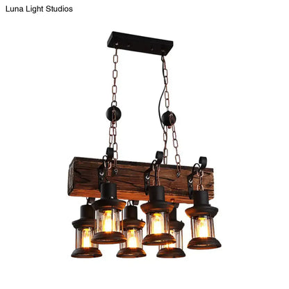 DecorBites farmhouse ceiling pendant light with five clear glass lanterns, rustic wood beam, and black metal chains