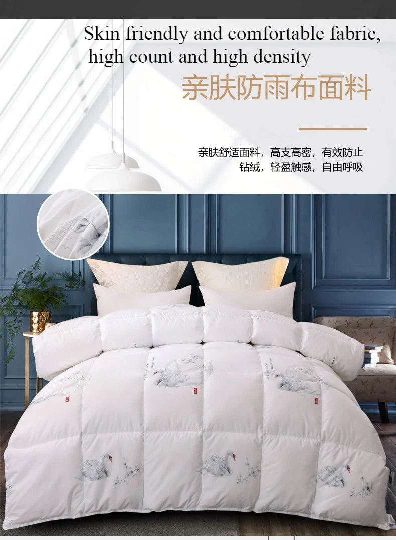 White quilted comforter with subtle gray swan embroidery and red accents made of high-quality white goose down