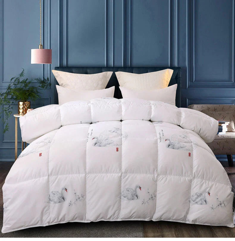 White goose down quilt with white quilted comforter featuring elegant black and gray swan illustrations and red seals