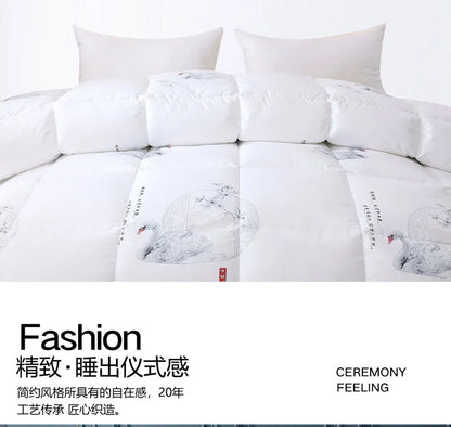 White goose down quilt with elegant black and gray swan ink illustrations and red seal accent for winter bedding