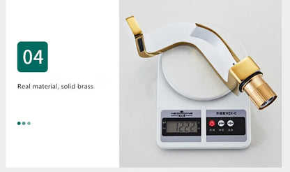 Gold-toned solid brass single hole bathroom faucet with polished finish and sleek curved design housing material brass