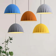 Four colorful felt pendant lights in blue orange gray and yellow with ribbed dome design for acoustic office use