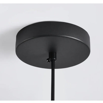 Black matte felt pendant light with a circular acoustic design for modern office spaces