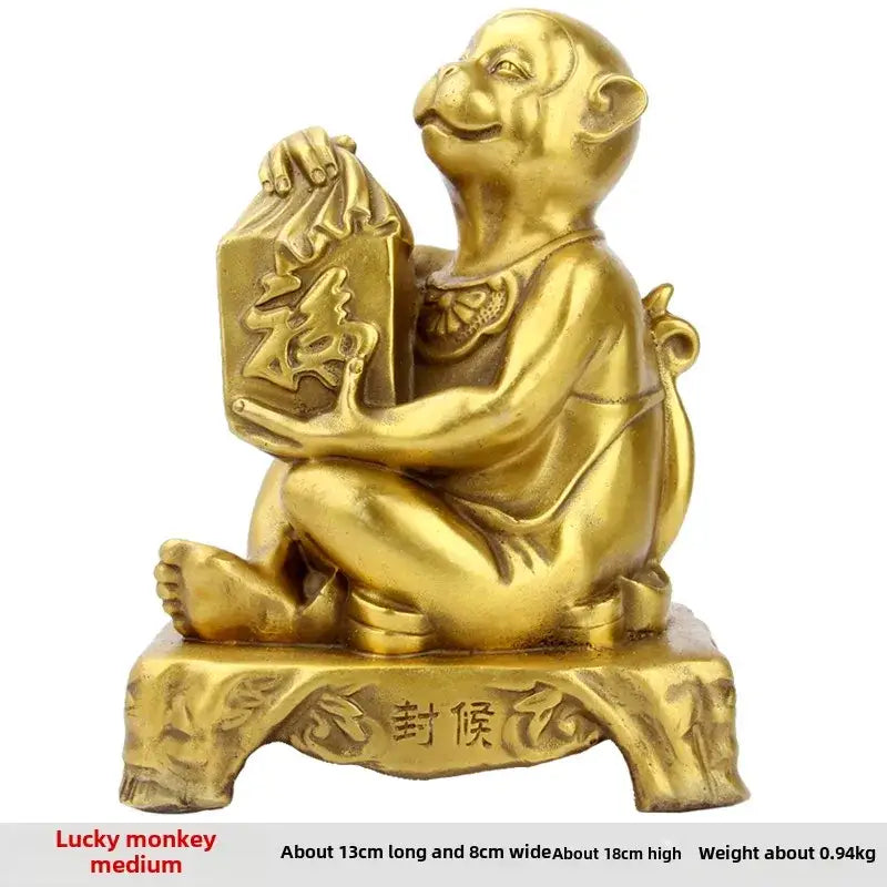Golden brass copper monkey figurine seated holding a box with chinese characters feng shui wealth decor