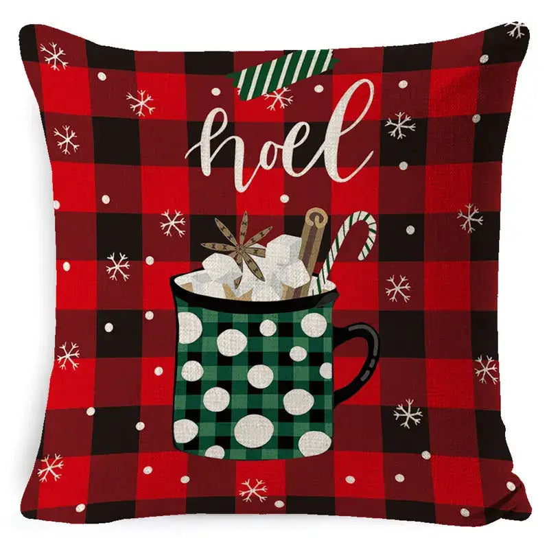 Festive red and black decorbites elk print linen pillowcase with green polka dot mug filled with marshmallows and spices