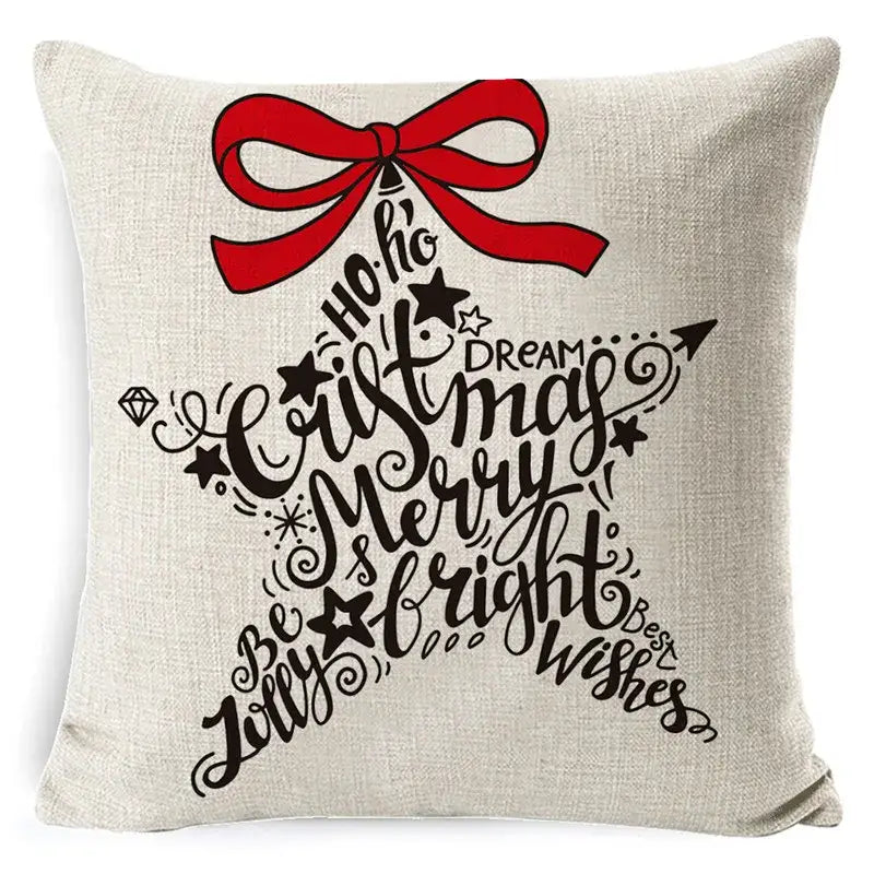 Beige linen throw pillow with festive star design black cursive holiday text and red bow elk print linen decorbites decor