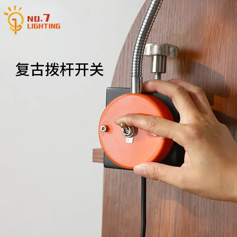 Orange circular vintage toggle switch with metallic knob and flexible hose on decorbites adjustable led desk lamp
