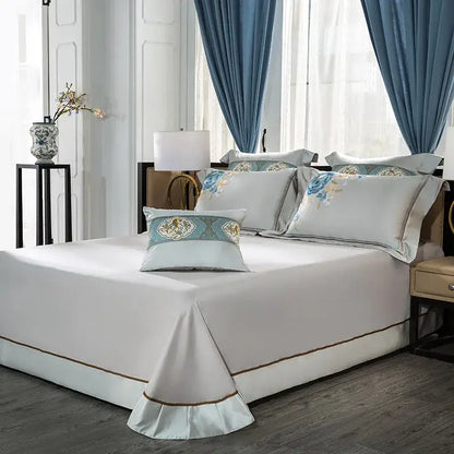 Elegant white satin floral 200s embroidered egyptian cotton bedding set with gold trim and soft blue pillows