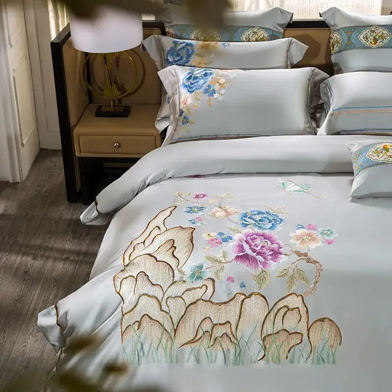 Light blue satin duvet cover from floral 200s embroidered egyptian cotton bedding set with vibrant floral and mountain design