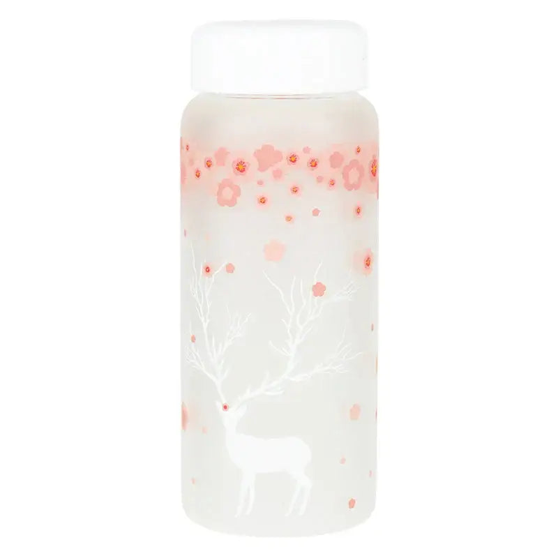 A frosted glass water bottle with a white lid featuring pink floral patterns and a white deer silhouette against a soft gradient background