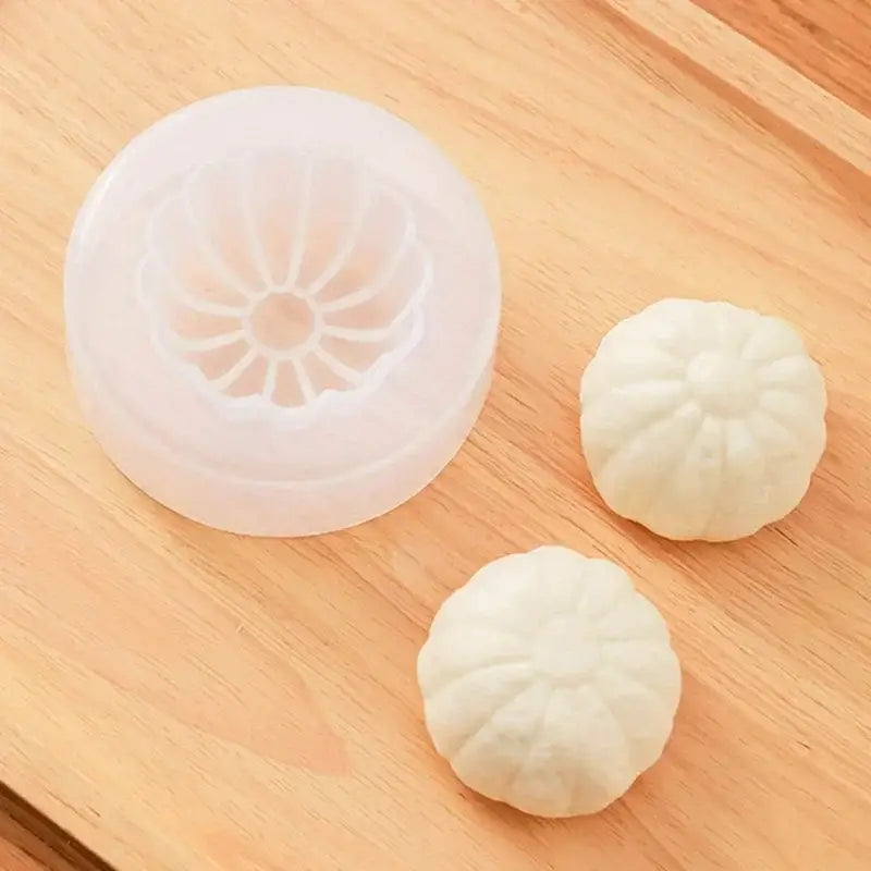 White silicone pumpkin-shaped baozi mold with two matching diy dumplings for floral and shell diy dumpling maker use