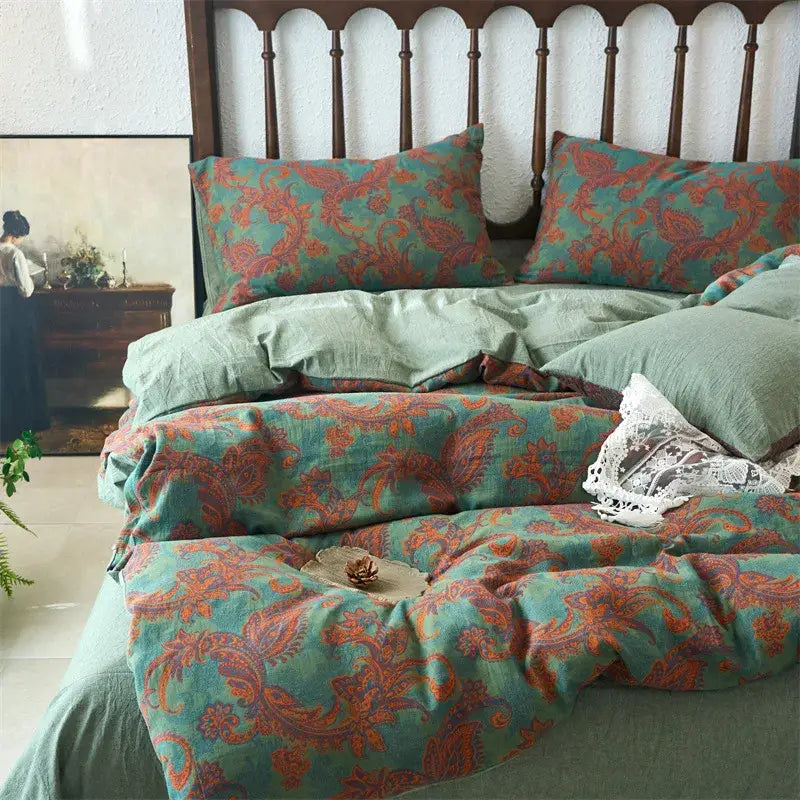 Teal and rust paisley-patterned linen duvet cover set complementing floral beige and brown jacquard cotton bedding
