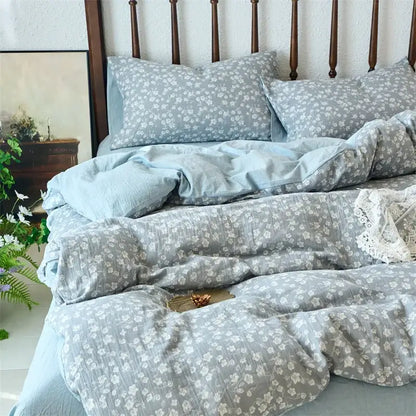 Light blue and white floral patterned duvet cover set in soft textured cotton fabric for bedroom use