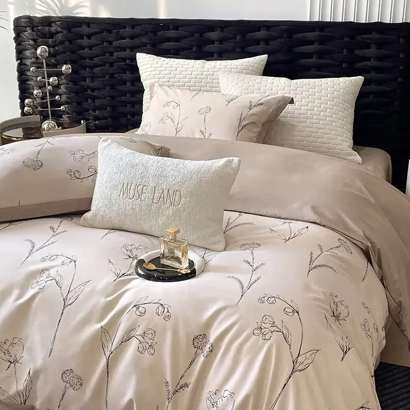 Beige satin egyptian cotton bedding set with black floral embroidery and muse land textured accent pillow
