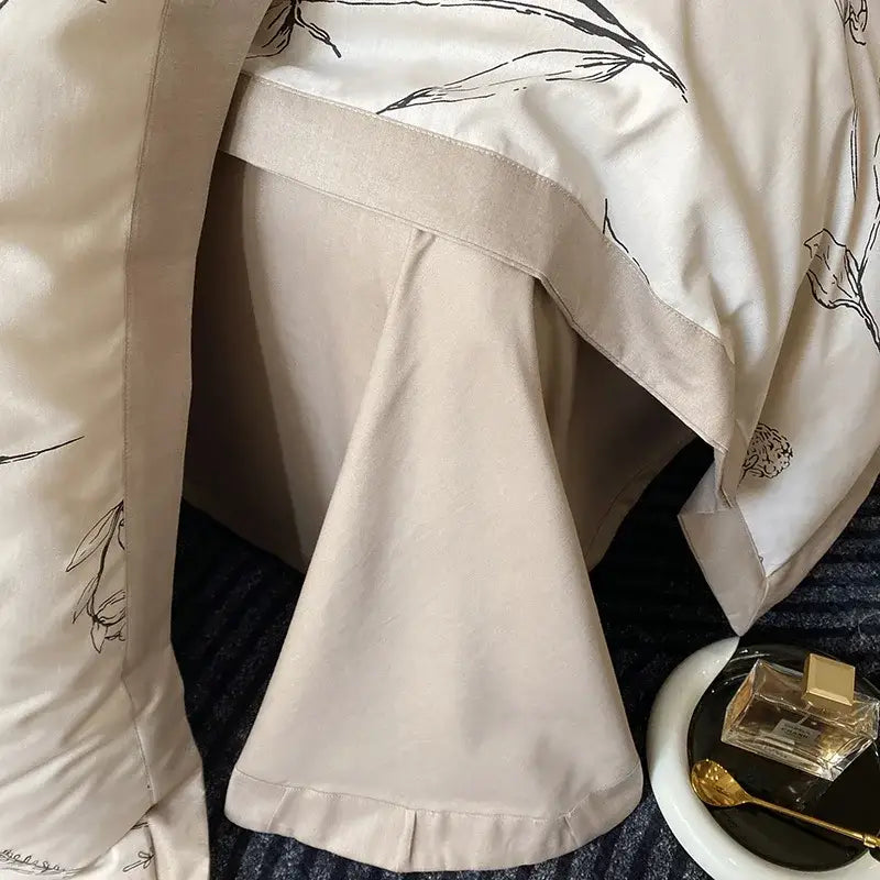Beige satin pillowcase with black line-art floral embroidery edge from egyptian cotton bedding set bedroom muse land print