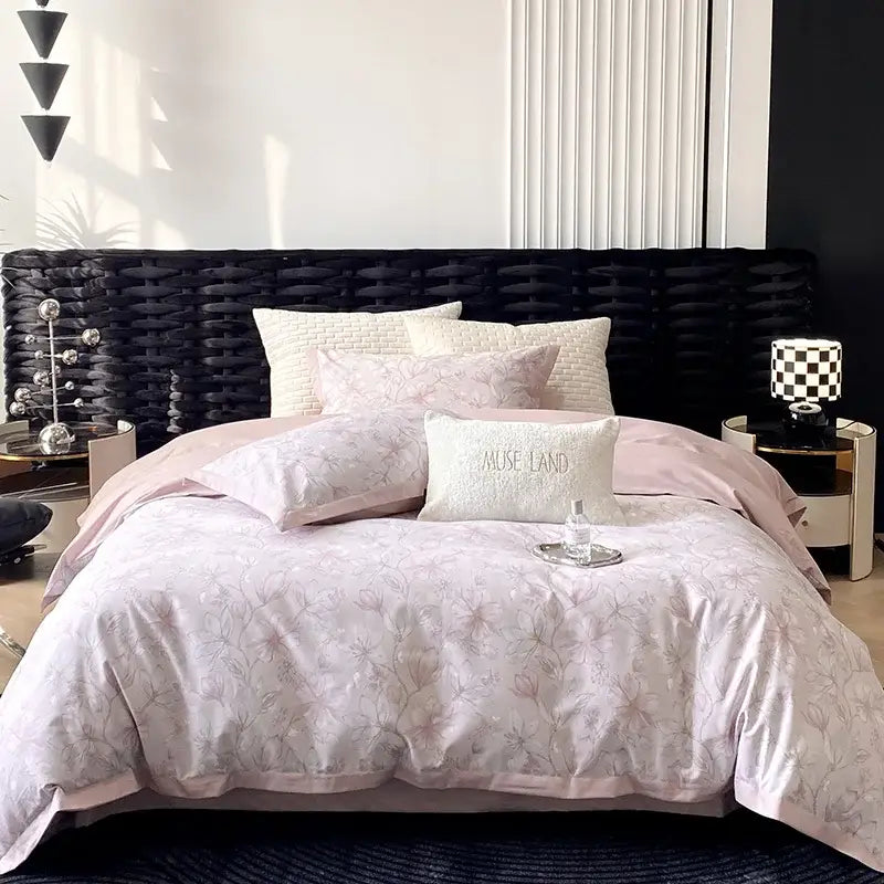 Pink floral-patterned egyptian cotton bedding set with matching pillows and white accent pillow mause land print