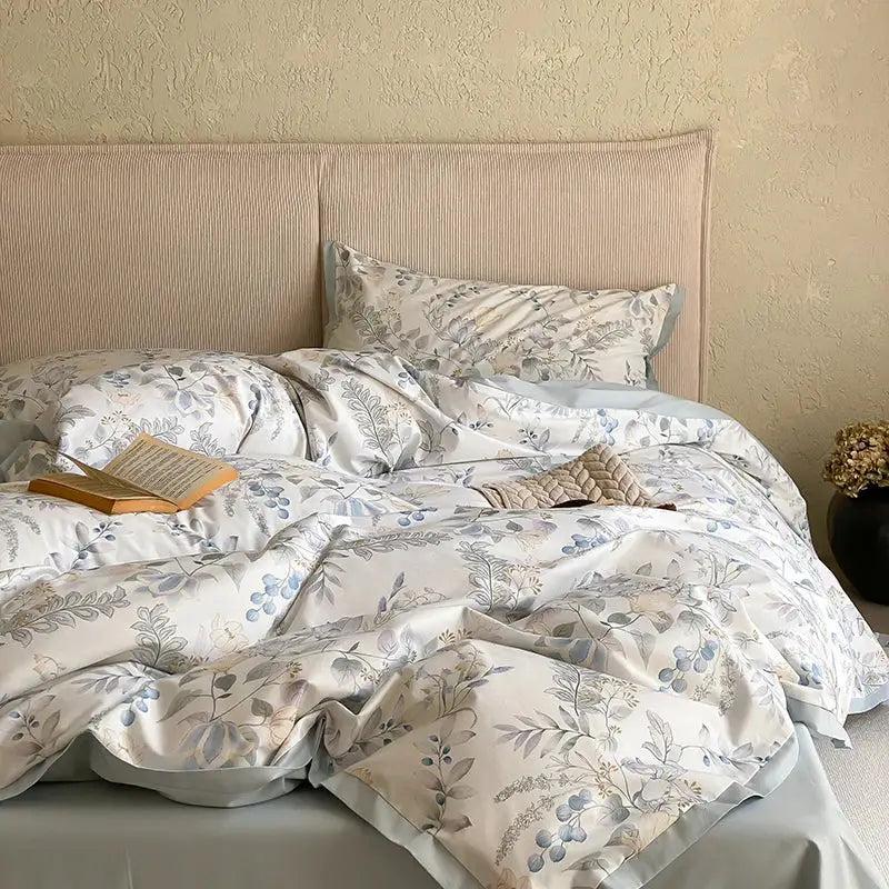 Floral beige egyptian cotton bedding set featuring a soft cream cotton bedding set with muted blue and gray botanical print