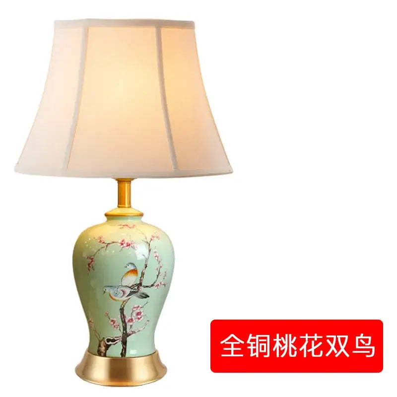 Delicate mint-green floral bird ceramic vase table lamp with hand-painted cherry blossoms and gold fittings for living room decor