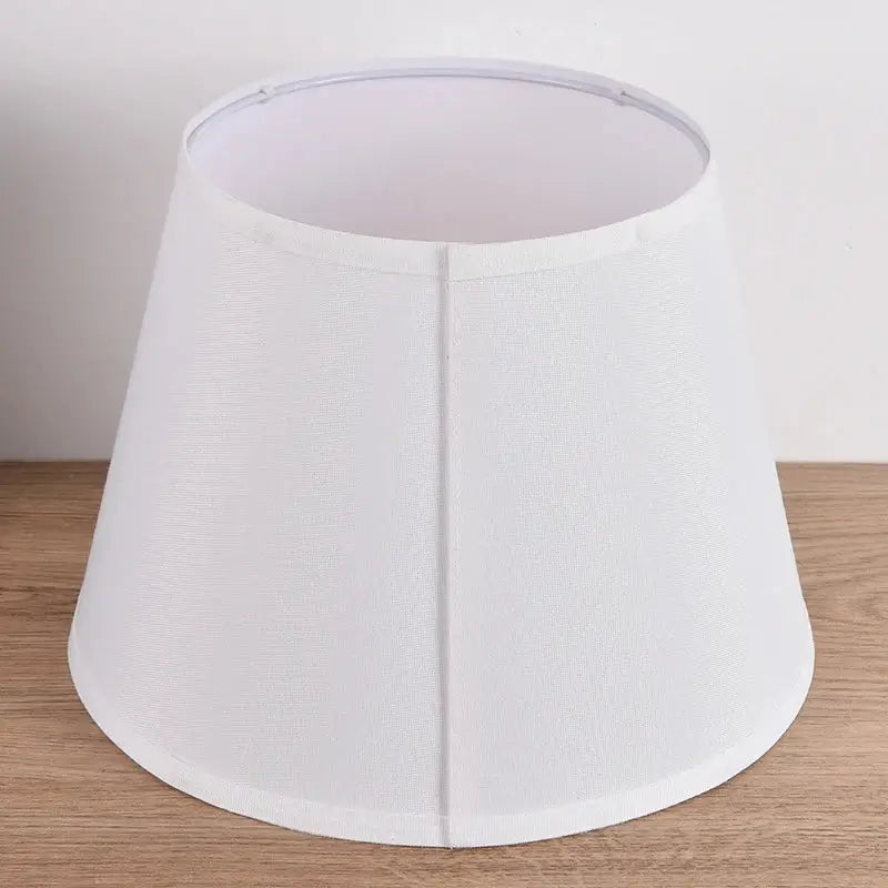 Floral bird hand painted ceramic table lamp with 30cm white fabric lampshade featuring subtle textured pattern and seams