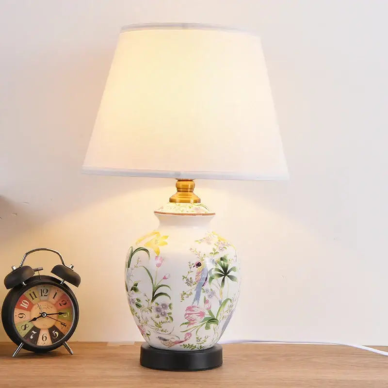 Floral bird hand painted ceramic table lamp with intricate design gold base and 30cm white fabric lampshade