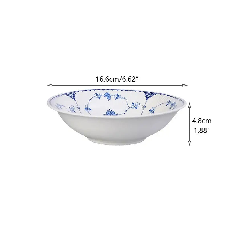 White ceramic dinner plate with delicate blue floral and vine patterns rim from decorbites ceramic dinnerware set