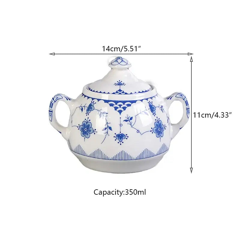 White ceramic sugar bowl with blue floral and geometric patterns and two handles in decorbites ceramic dinner set