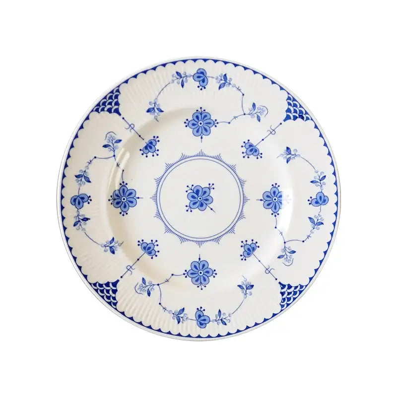 Floral blue and white ceramic dinner plate with intricate vine patterns and scalloped edge by decorbites ceramic dinnerware