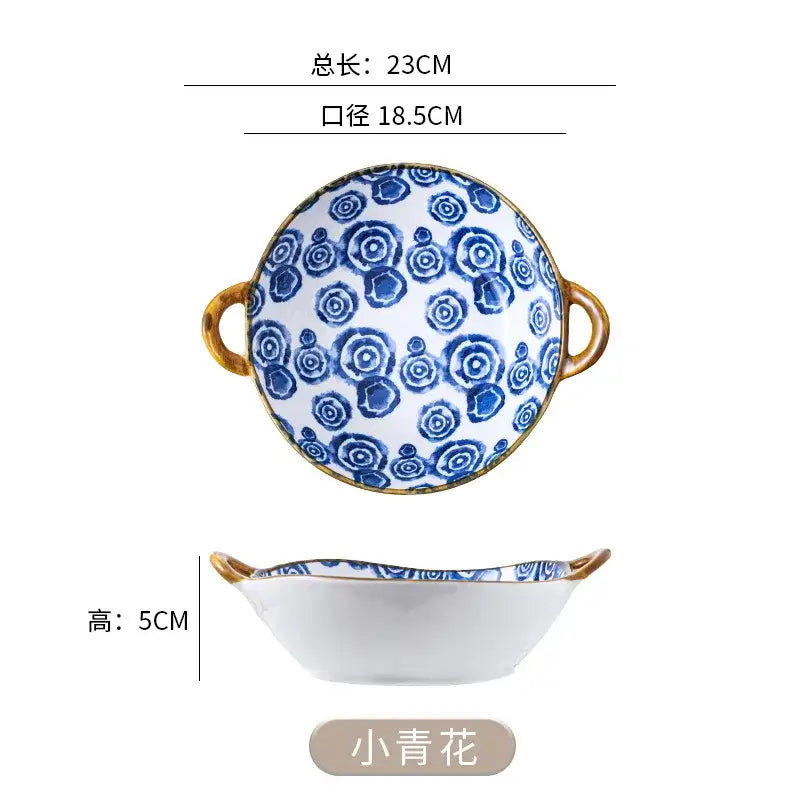 A white ceramic double ear ramen soup bowl with blue floral patterns and gold handles labeled xiao qinghua decorbites ceramic double