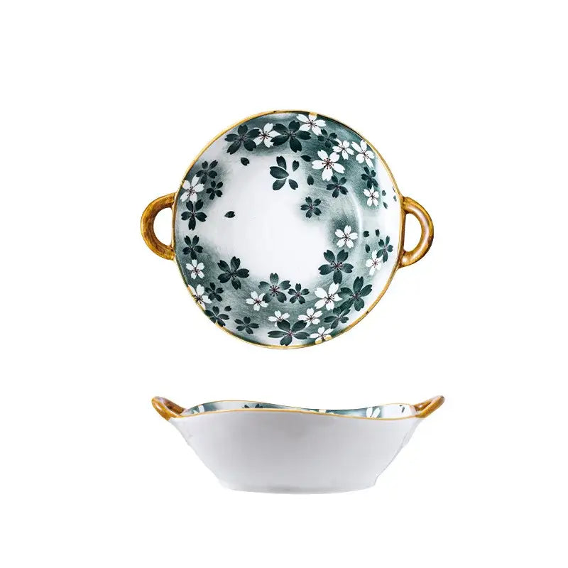 A decorbites ceramic double ear ramen soup bowl with white base, black and white cherry blossoms, gold rims, and handles