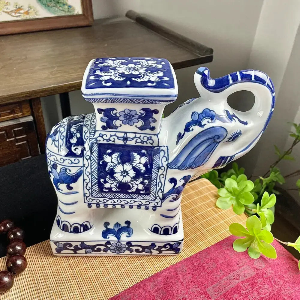 Floral blue and white ceramic elephant statue with intricate floral patterns and square-shaped trunk for living room decorbites elephant statue