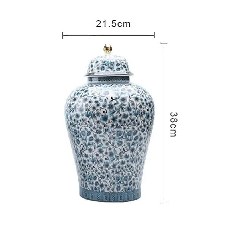 A decorative blue white ceramic ginger jar with floral pattern and gold-tipped lid for living room decorbites decor