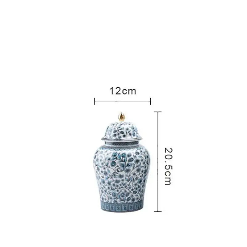 A decorative blue white ceramic ginger jar with floral pattern and gold tipped lid from decorbites living room decor