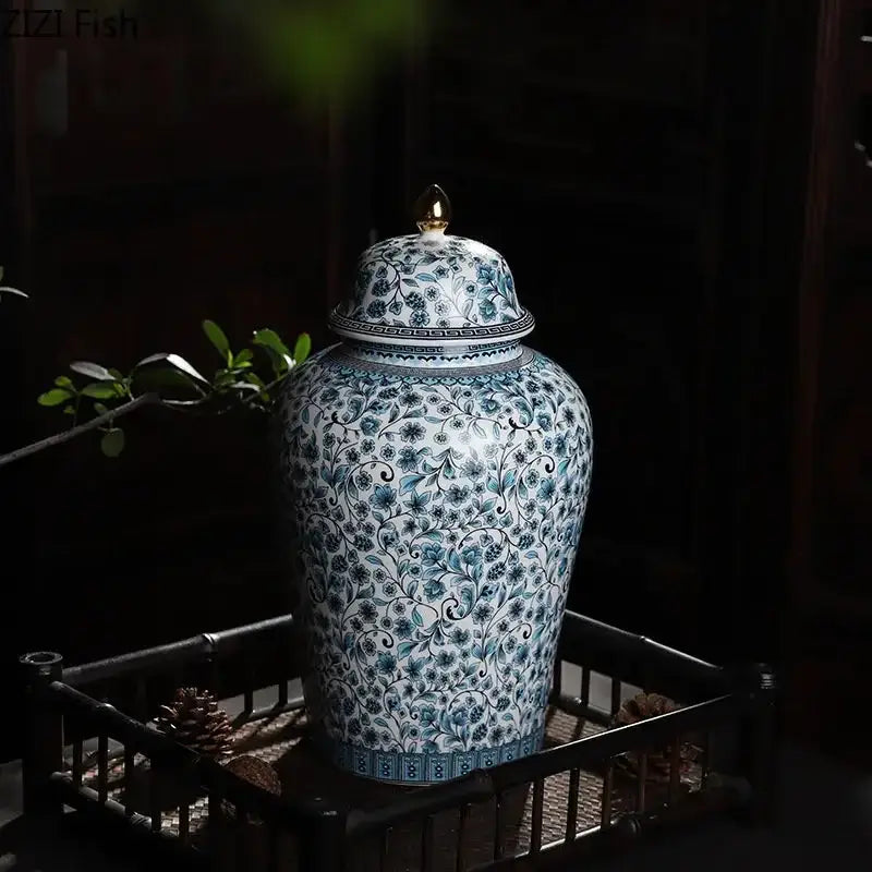 White ceramic enamel ginger jar with intricate blue floral patterns and gold-tipped lid for living room decorbites blue white decor
